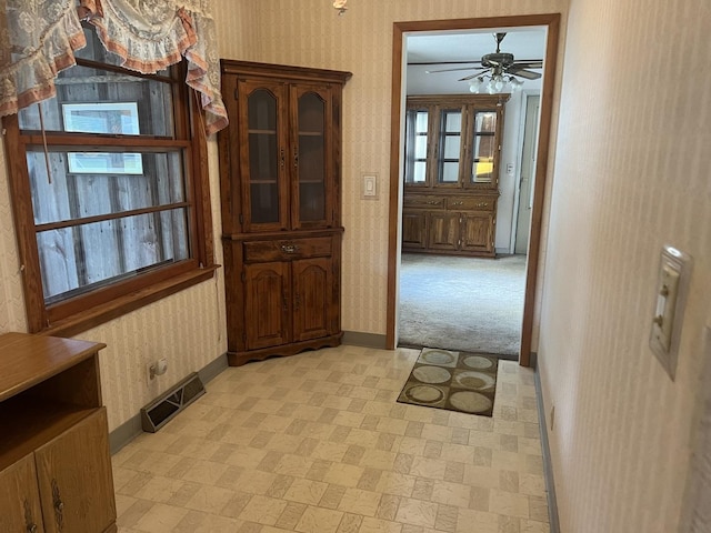 204 Elm St, Morrison, IL 61270 - entryway with baseboards, wallpapered walls, a ceiling fan, and light flooring