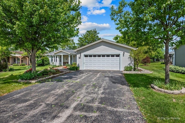 14 Devonshire Ct, Grayslake, IL 60030 - ranch-style house featuring a front lawn, a garage, and driveway