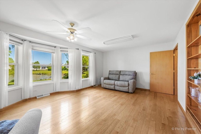 14 Devonshire Ct, Grayslake, IL 60030 - unfurnished room featuring light wood finished floors, a ceiling fan, and a water view