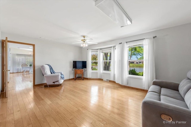 14 Devonshire Ct, Grayslake, IL 60030 - living area with light wood-style flooring, ceiling fan, and baseboards