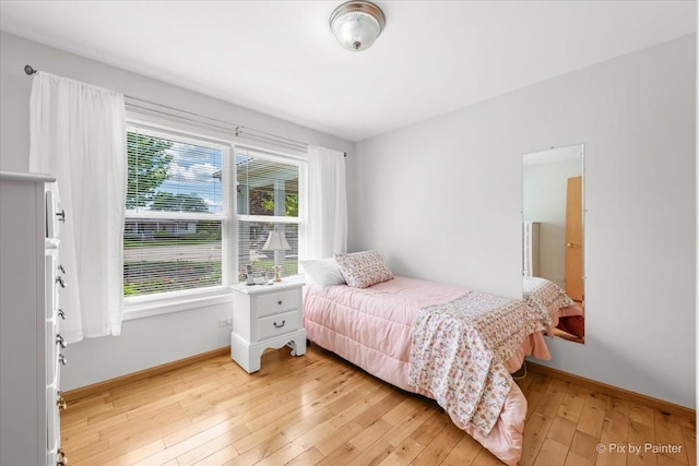 14 Devonshire Ct, Grayslake, IL 60030 - bedroom featuring light wood-style flooring and baseboards