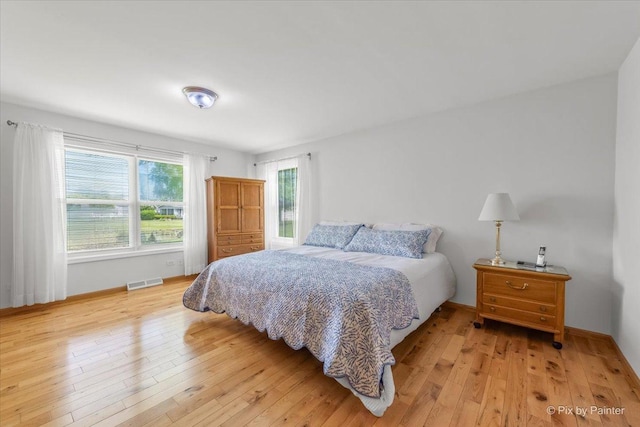14 Devonshire Ct, Grayslake, IL 60030 - bedroom featuring light wood finished floors and baseboards