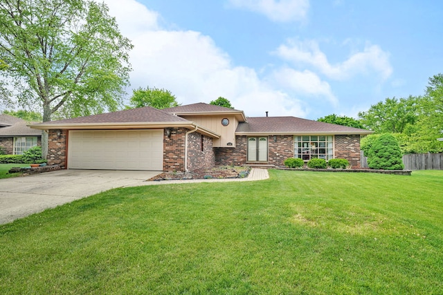 25408 W Willow Dr, Plainfield, IL 60544 - tri-level home featuring a garage, driveway, brick siding, and roof with shingles