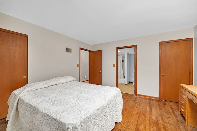 25408 W Willow Dr, Plainfield, IL 60544 - bedroom featuring light wood-style flooring, baseboards, and ensuite bathroom