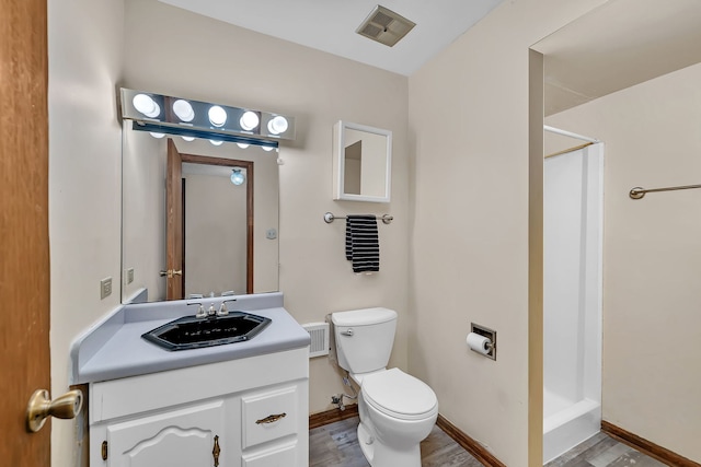 25408 W Willow Dr, Plainfield, IL 60544 - full bathroom featuring a shower stall, toilet, vanity, and wood finished floors