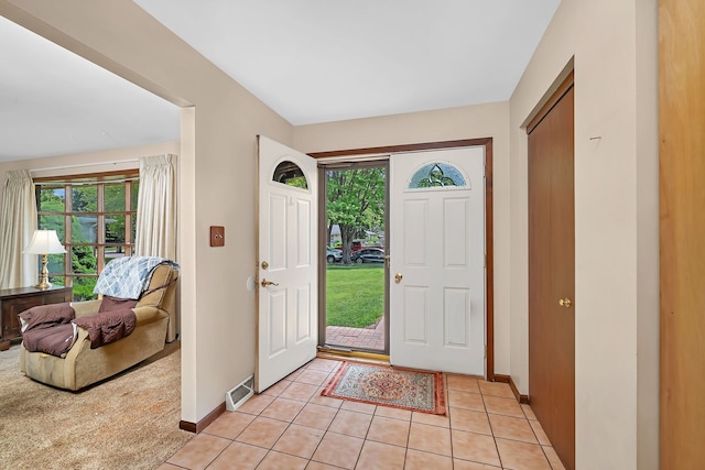 25408 W Willow Dr, Plainfield, IL 60544 - foyer entrance with plenty of natural light, baseboards, and light tile patterned floors