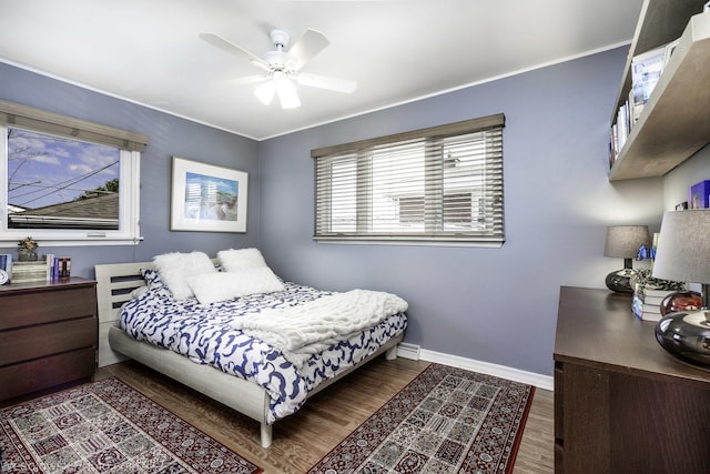 5036 Ozark Ave, Norridge, IL 60706 - bedroom featuring wood finished floors, baseboards, ornamental molding, and ceiling fan