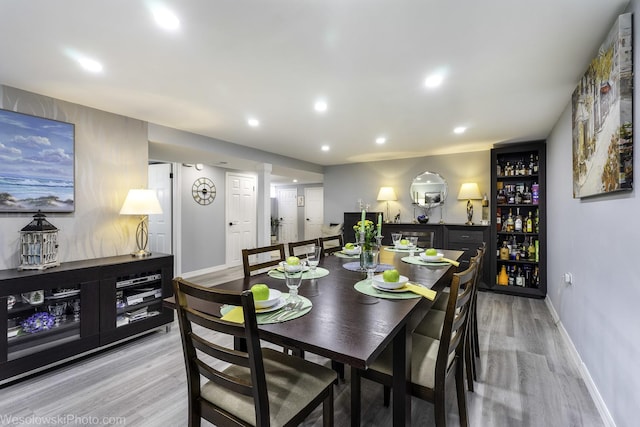 5036 Ozark Ave, Norridge, IL 60706 - dining room with light wood-style floors, baseboards, recessed lighting, and a dry bar