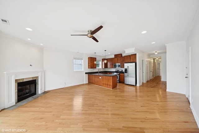 3560 S Giles Ave Unit 2, Chicago, IL 60653 - kitchen with appliances with stainless steel finishes, open floor plan, dark countertops, ornamental molding, and ceiling fan