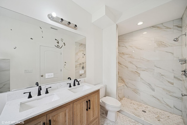 3560 S Giles Ave Unit 2, Chicago, IL 60653 - bathroom with toilet, double vanity, a marble finish shower, and recessed lighting