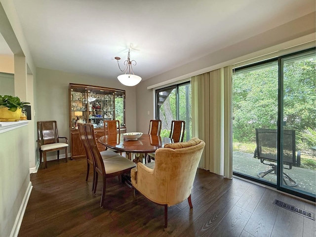 258 Brookside Ln Unit B, Willowbrook, IL 60527 - dining space with dark wood-style floors and baseboards