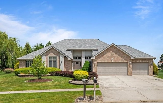 22351 Autumn Dr, Frankfort, IL 60423 - view of front of house with an attached garage, driveway, brick siding, and a front yard