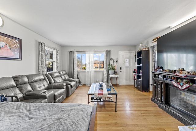 1520 Pennsylvania Ave, Des Plaines, IL 60018 - living area with light wood-type flooring and a glass covered fireplace