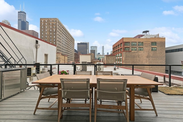 727 S Dearborn St Unit 911, Chicago, IL 60605 - deck featuring a view of skyline and outdoor dining space
