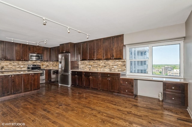 4250 N Marine Dr Unit 1628, Chicago, IL 60613 - kitchen with appliances with stainless steel finishes, dark wood-style floors, light countertops, backsplash, and dark brown cabinets
