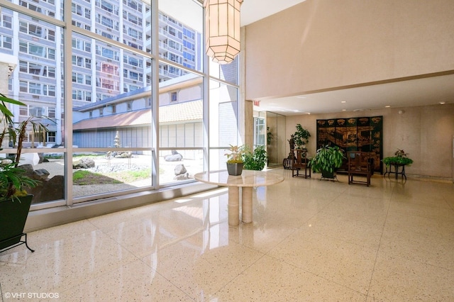 4250 N Marine Dr Unit 1628, Chicago, IL 60613 - building lobby with a high ceiling and a wall of windows