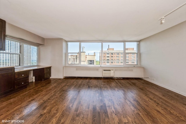 4250 N Marine Dr Unit 1628, Chicago, IL 60613 - unfurnished living room featuring dark wood-style floors, healthy amount of natural light, radiator heating unit, and an office area