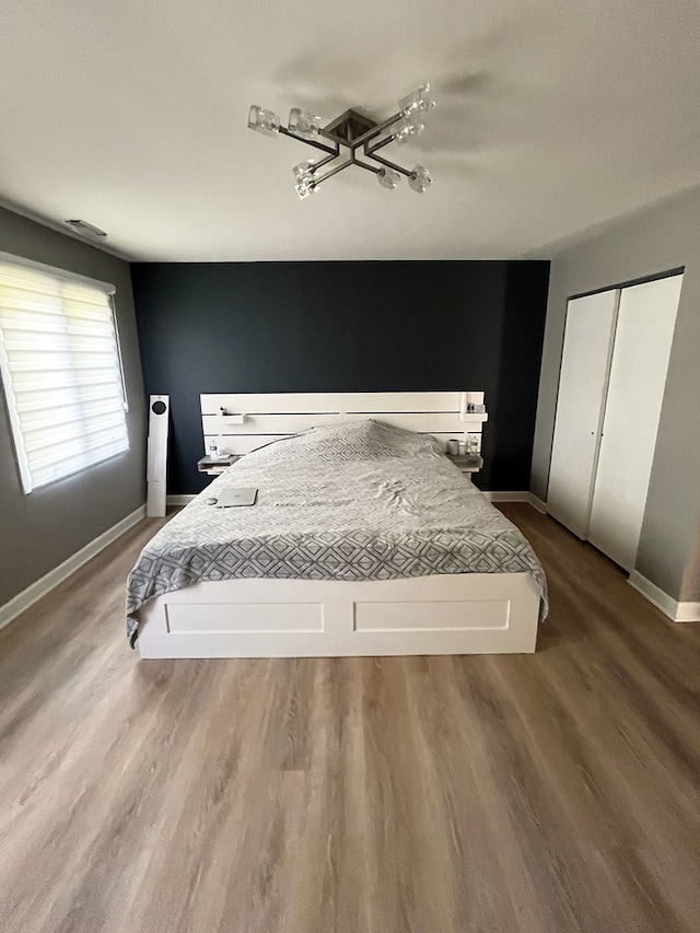 985 W Ct Unit D, Naperville, IL 60563 - bedroom featuring baseboards and wood finished floors