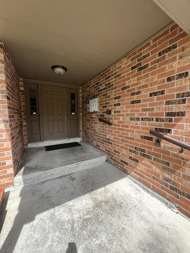985 W Ct Unit D, Naperville, IL 60563 - property entrance with an attached carport and brick siding