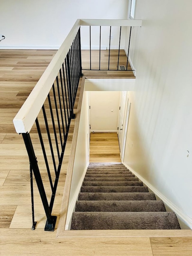 238 Chippewa Ct Unit D, Bolingbrook, IL 60440 - stairway featuring baseboards and wood finished floors