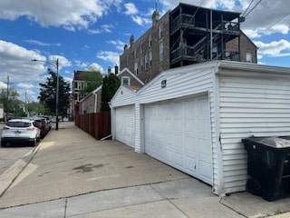2300 W 19th St, Chicago, IL 60608 - view of side of property with a detached garage and an outdoor structure