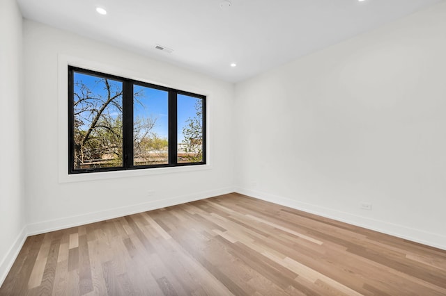 3903 N Drake Ave, Chicago, IL 60618 - spare room featuring light wood-type flooring, recessed lighting, and baseboards