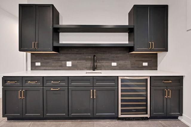3903 N Drake Ave, Chicago, IL 60618 - bar with beverage cooler, a sink, tasteful backsplash, and baseboards