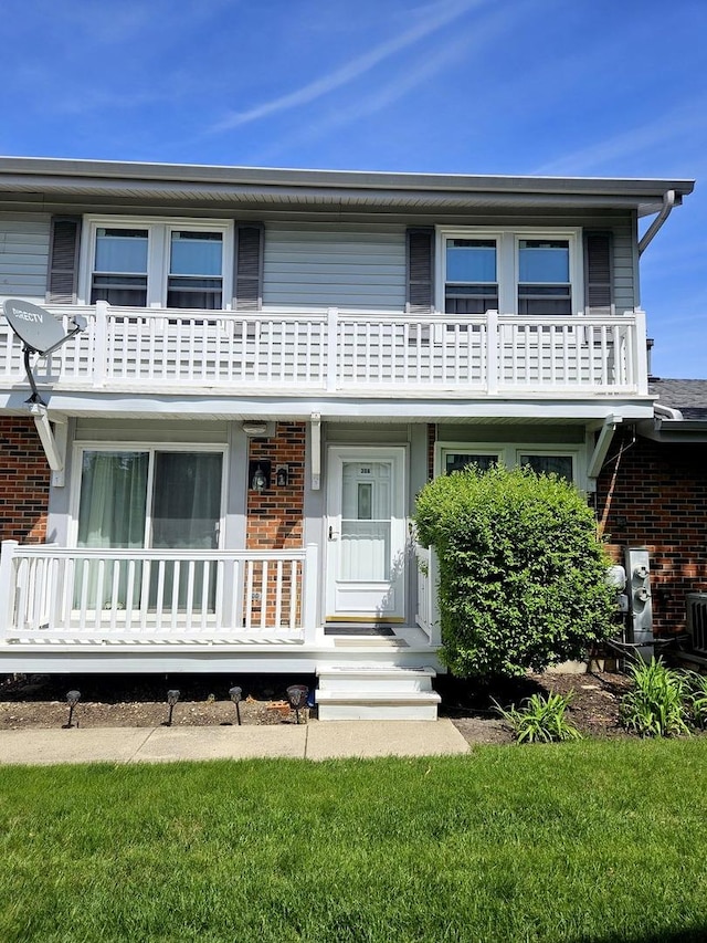 306 Milton Ct Unit B, Bloomingdale, IL 60108 - view of front facade with brick siding and a balcony