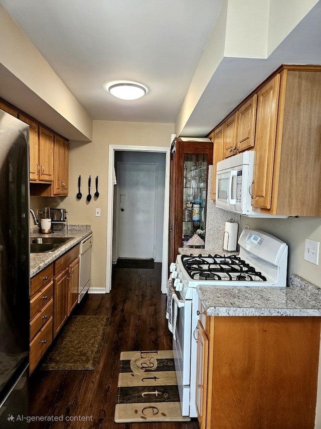 306 Milton Ct Unit B, Bloomingdale, IL 60108 - kitchen featuring white appliances, dark wood finished floors, a sink, light countertops, and baseboards