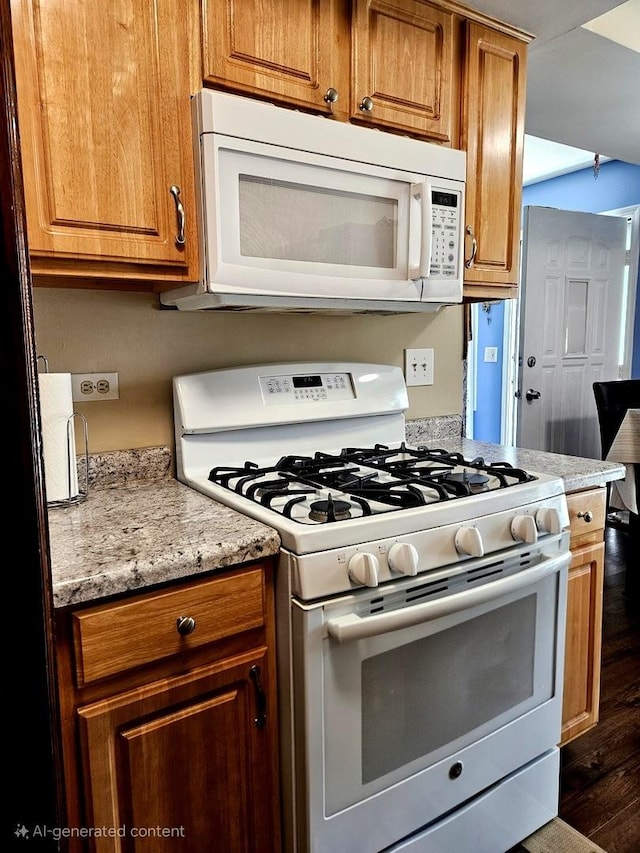 306 Milton Ct Unit B, Bloomingdale, IL 60108 - kitchen with white appliances, dark wood-style flooring, brown cabinetry, and light stone countertops