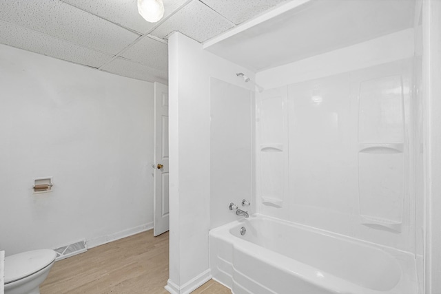 2022 S Halsted St, Chicago Heights, IL 60411 - full bath with  shower combination, toilet, wood finished floors, a drop ceiling, and baseboards