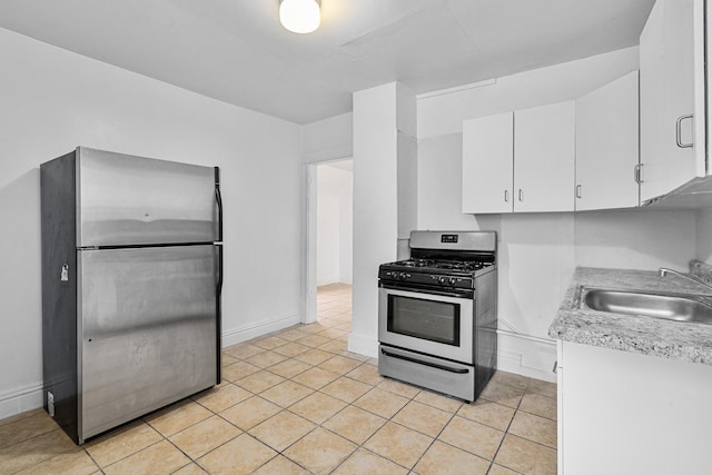 2022 S Halsted St, Chicago Heights, IL 60411 - kitchen featuring stainless steel appliances, a sink, white cabinets, light countertops, and light tile patterned floors