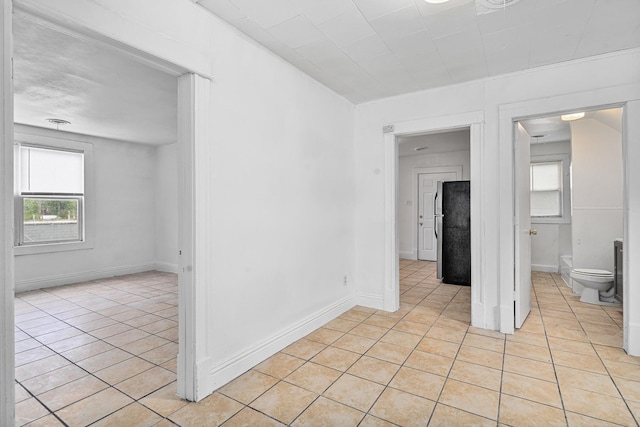 2022 S Halsted St, Chicago Heights, IL 60411 - spare room featuring light tile patterned floors and baseboards