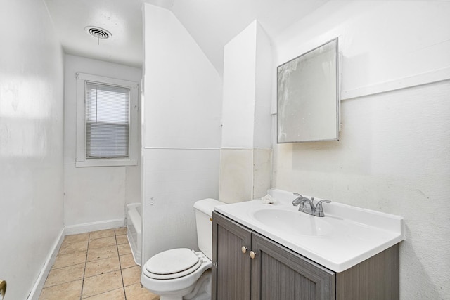 2022 S Halsted St, Chicago Heights, IL 60411 - bathroom with toilet, vanity, a tub to relax in, baseboards, and tile patterned flooring