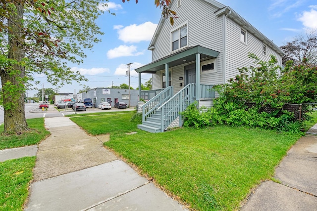 2022 S Halsted St, Chicago Heights, IL 60411 - view of front facade with a front yard and a porch