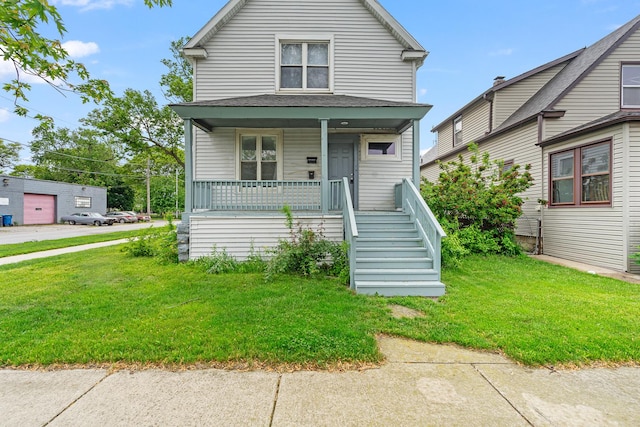 2022 S Halsted St, Chicago Heights, IL 60411 - american foursquare style home with covered porch, a front lawn, and stairway