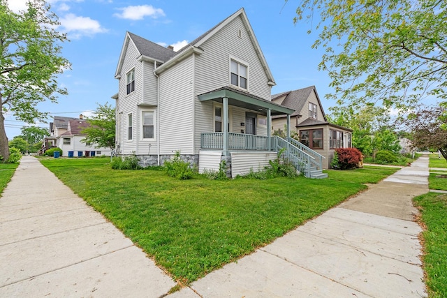 2022 S Halsted St, Chicago Heights, IL 60411 - view of side of property with a porch and a yard