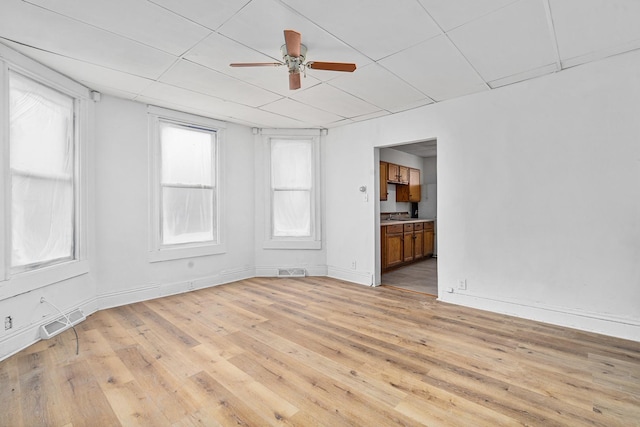 2022 S Halsted St, Chicago Heights, IL 60411 - empty room with light wood finished floors, ceiling fan, and baseboards