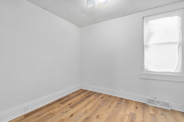 2022 S Halsted St, Chicago Heights, IL 60411 - unfurnished room featuring a paneled ceiling, baseboards, and light wood finished floors