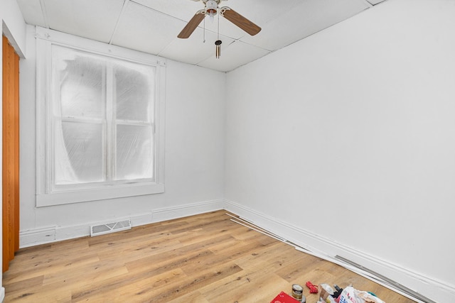 2022 S Halsted St, Chicago Heights, IL 60411 - empty room with wood finished floors, a ceiling fan, and baseboards