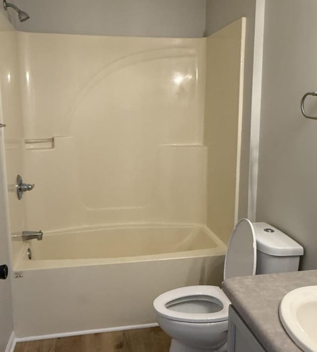 1117 Cutter Ave, Joliet, IL 60432 - bathroom featuring toilet, vanity, shower / bathtub combination, and wood finished floors