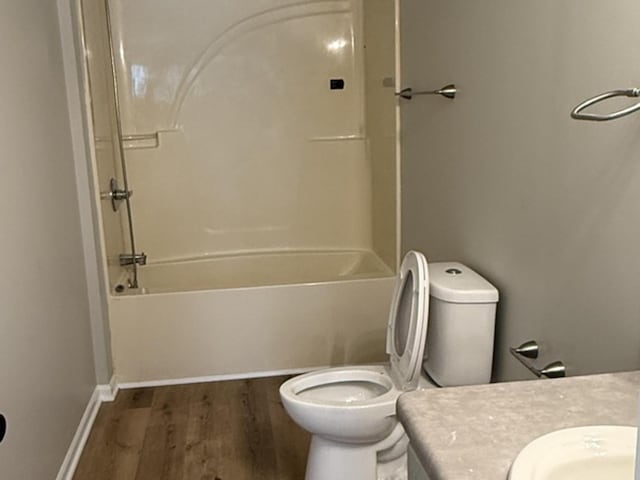 1117 Cutter Ave, Joliet, IL 60432 - full bath with wood finished floors, vanity, toilet, bathtub / shower combination, and baseboards