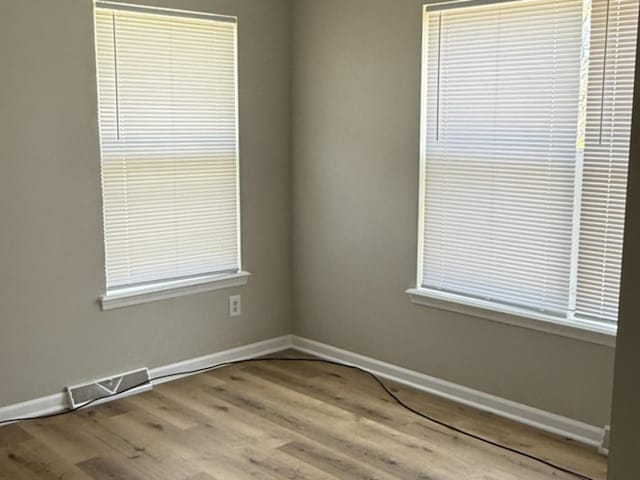 1117 Cutter Ave, Joliet, IL 60432 - empty room featuring wood finished floors and baseboards