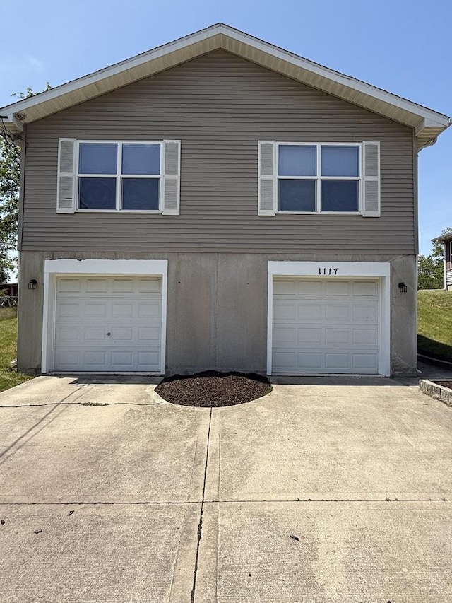 1117 Cutter Ave, Joliet, IL 60432 - view of front of property with concrete driveway and a garage