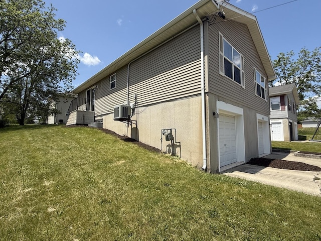 1117 Cutter Ave, Joliet, IL 60432 - view of home's exterior with a yard, a garage, concrete driveway, and stucco siding