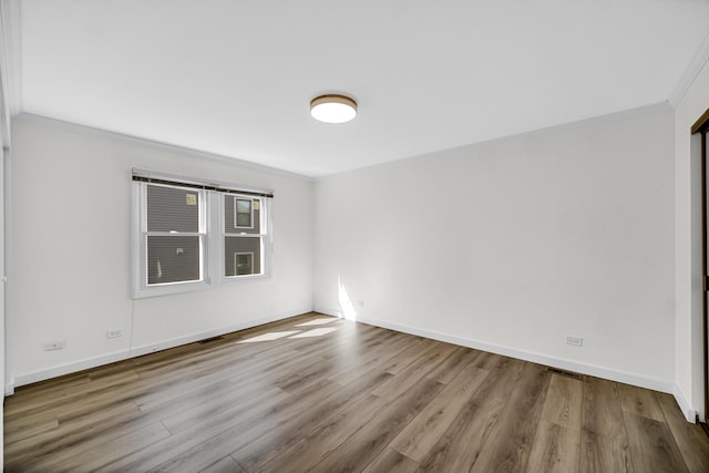3795 Whispering Trails Dr, Hoffman Estates, IL 60192 - spare room with crown molding, wood finished floors, and baseboards