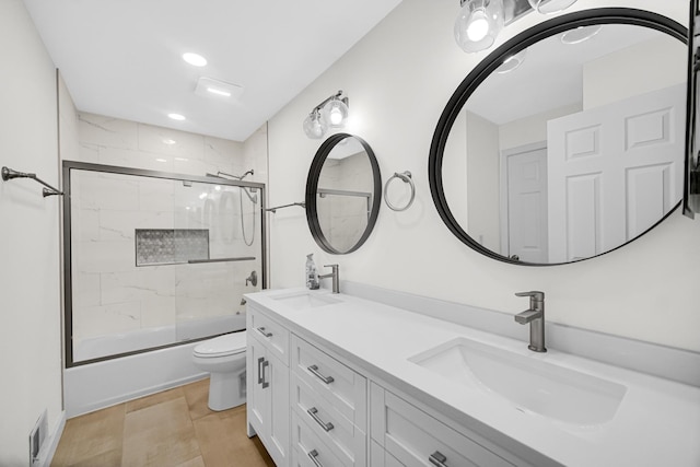 3795 Whispering Trails Dr, Hoffman Estates, IL 60192 - bathroom featuring toilet, double vanity, bath / shower combo with glass door, and recessed lighting