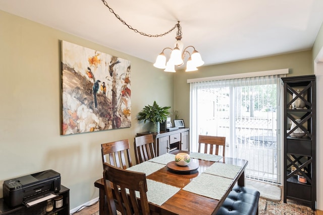 903 Wiltshire Dr Unit S2, Mchenry, IL 60050 - dining area featuring a chandelier and wood finished floors