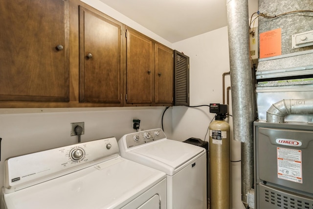 903 Wiltshire Dr Unit S2, Mchenry, IL 60050 - laundry area featuring cabinet space, independent washer and dryer, and heating unit