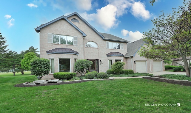 1420 Greenlake Dr, Aurora, IL 60502 - traditional-style home with brick siding, a front lawn, concrete driveway, and a garage